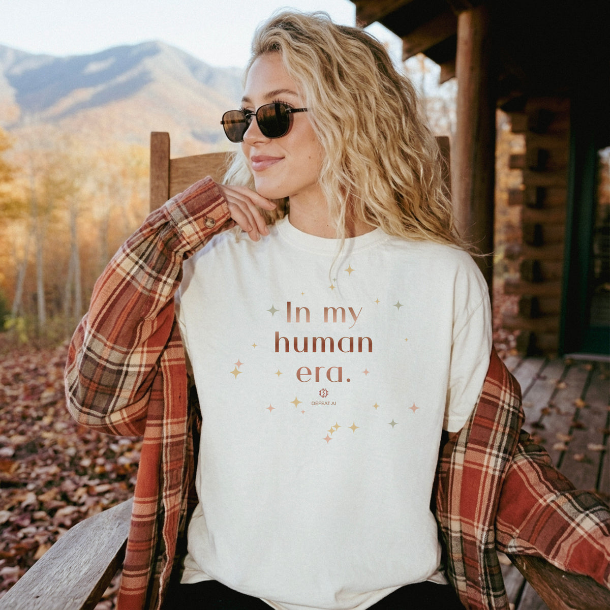 Woman wearing an ivory In My Human Era Comfort Colors T-shirt outdoors
