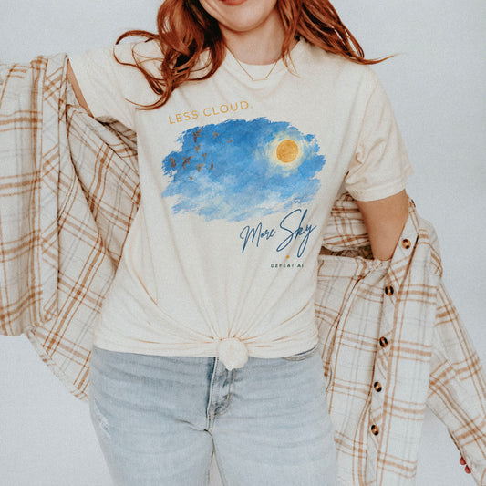 Woman wearing the Less Cloud, More Sky Comfort Colors T-shirt in ivory